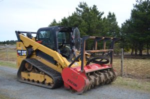 mulching mower head on tracked skid-steer